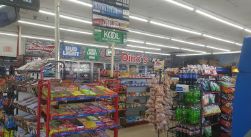 Inside Dino Food Mart: candy racks, snack aisles and drink coolers
