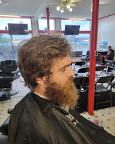 Client with a longer swept cut and a full, shaped beard